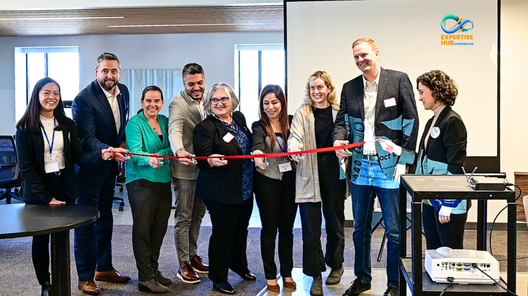 Ministers, community partners, and members of Expertise Hub Co-operative at the official launch ribbon-cutting ceremony.